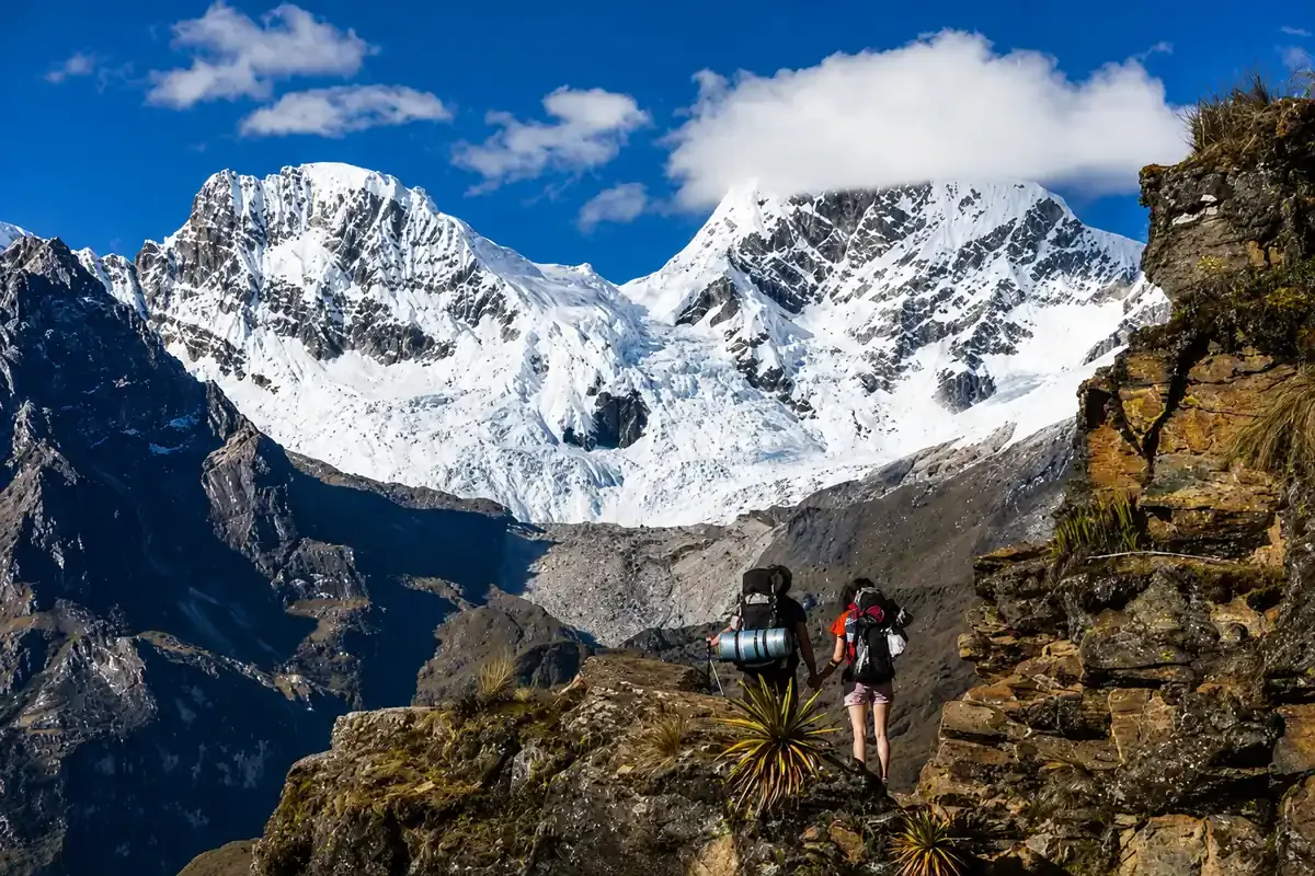 Hikers below the snow covered Salkantay mountain